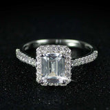 Silver engagement ring for women with a round blue sapphire center stone and prong setting