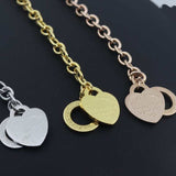 Charm heart bangle chain bracelets for women in silver, gold, and rose gold with round charm pendants and toggle clasps.