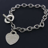 Silver charm heart bangle bracelet for women with toggle clasp and rolo chain in 316L titanium steel