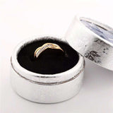 Twisted gold zircon ring for women in a silver floral round gift box