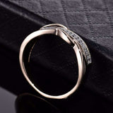 Twisted gold zircon women's engagement ring with prong setting and round zircon stones on 14k yellow gold plated band