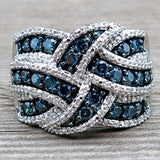 Silver women's cocktail ring with white sapphire gemstone in prong setting and round pattern design