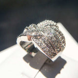 White sapphire gemstone cocktail ring for women with silver prong setting and round shape design