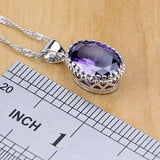 Close-up of a purple amethyst pendant necklace in 925 silver on a ruler showing size.