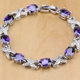 Silver bracelet with round purple amethyst stones and crystal accents in an elegant design