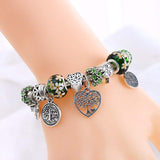 Tree of Life charm bracelet for women with Tibetan silver and green floral beads, perfect for anniversary or party jewelry