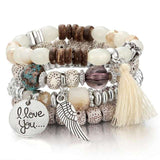 Vintage wristband beaded bracelet for women with charm pendants and tassel detail