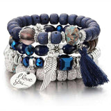 Stack of vintage wristband beaded bracelets for women with silver charms, blue beads, tassel, and "I love you" pendant