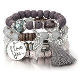 Vintage wristband beaded bracelet for women with silver charms, tassel, and bohemian style accents