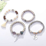 Set of vintage wristband beaded bracelets for women with silver charms and bohemian style