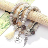 Vintage wristband beaded bracelet for women with silver charms and tassel accessory