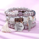 Vintage wristband beaded bracelet for women with silver charms, tassel, and round acrylic beads in bohemia style