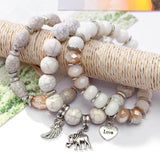 Vintage wristband beaded bracelet for women with silver charms and acrylic round beads in bohemian style