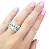 Luxury sapphire engagement ring in 925 silver with geometric design and prong setting worn on hand