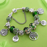 Silver Tree of Life charm bracelet with green and floral beads for women anniversary and party jewelry