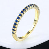 18K rose gold plated women's zircon engagement ring with round blue stones and tension setting