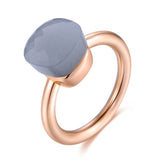 Natural blue topaz ring in 14K rose gold with tension mount, classic round design for women weddings and engagements