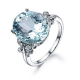 Princess Aquamarine Ring for women with oval aquamarine gemstone set in silver band with decorative accents, engagement and wedding jewelry