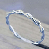Silver princess aquamarine ring for women with twisted design and small gemstones, suitable for engagement and wedding jewelry