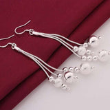 Long silver dangle drop earrings for women with water drop shaped silver beads, trendy wedding jewelry