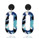 Trendy geometric drop earrings in silver and acrylic with black, blue, and white pattern for women wedding jewelry