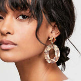 luxury silver drop earrings with geometric acrylic design worn by woman for wedding jewelry