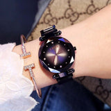 Princess Starry Sky Magnet Watch with round black dial and crystal accents on black stainless steel mesh band worn on wrist with matching bracelet