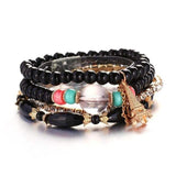 Vintage wristband beaded bracelet for women with black beads, colorful accents, and Eiffel Tower charm