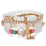 Vintage wristband beaded bracelet for women with acrylic beads, gold-tone Eiffel Tower charm, and rhinestone accents.