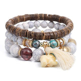 Vintage wristband beaded bracelet for women with bohemian style, acrylic beads, silver-tone charms, and tassel ornament