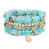 Vintage wristband beaded bracelet for women with turquoise beads, gold-tone accents, and charm detail in bohemian style
