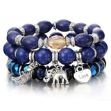 Vintage wristband beaded bracelet for women with blue beads, silver charms, and bohemian style design