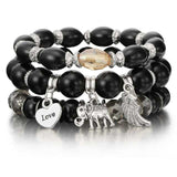Vintage wristband beaded bracelet for women with black beads, silver charms, and bohemian style accents