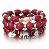 Vintage wristband beaded bracelet for women with red beads, silver charms, and easy-hook clasp