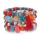 Vintage wristband beaded bracelet for women with multicolor acrylic beads, silver accents, round shapes, bohemian style, and red tassel charm