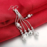 Long silver dangle earrings with multiple chains and textured silver beads for women wedding jewelry