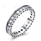 Princess white sapphire silver engagement ring for women with round gemstones and trendy wedding band design