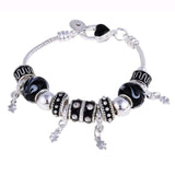 Silver charm bracelet with black and silver beads and dangling charms