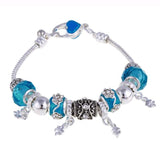 Silver charm bracelet with blue zircon beads and floral plant pattern charms for women