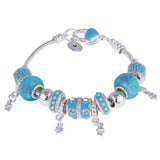 Silver charm bracelet with turquoise and silver beads and dangling charms
