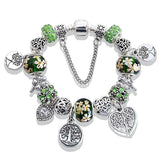Silver Tree of Life charm bracelet with green and floral beads, heart and flower charms for women’s anniversary party jewelry