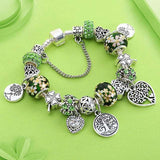Tree of Life Charm Bracelet for women with green and silver beads, floral and heart charms in Tibetan silver for anniversary and party.