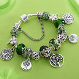 Silver and green Tree of Life charm bracelet for women with Tibetan silver beads and zircon accents, perfect for anniversary or party jewelry